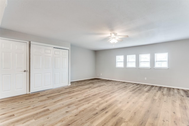 1601 Winderemere Dr, Arlington, TX 76014 - unfurnished bedroom with a closet, baseboards, and light wood-style floors