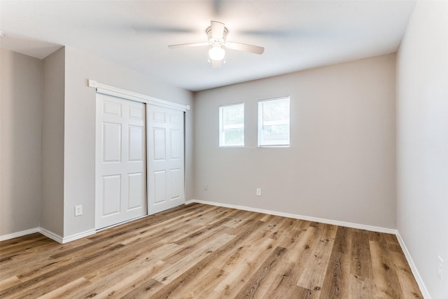 1601 Winderemere Dr, Arlington, TX 76014 - unfurnished bedroom featuring a closet, baseboards, ceiling fan, and light wood-type flooring