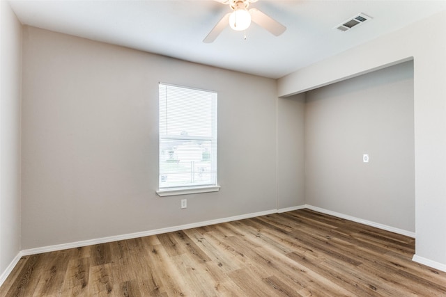 1601 Winderemere Dr, Arlington, TX 76014 - spare room with baseboards, ceiling fan, visible vents, and wood finished floors