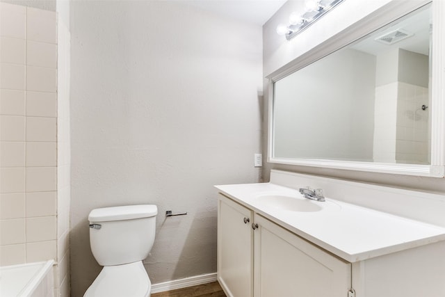 1601 Winderemere Dr, Arlington, TX 76014 - full bathroom with vanity, toilet, baseboards, a shower, and visible vents