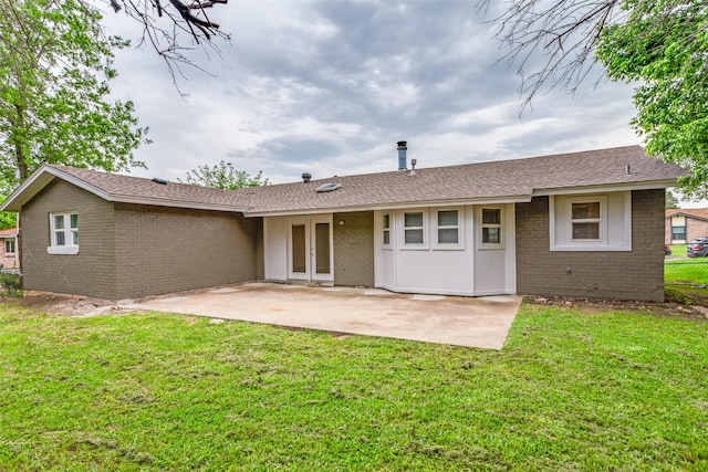 1601 Winderemere Dr, Arlington, TX 76014 - back of house featuring fence, brick siding, a patio area, french doors, and a yard