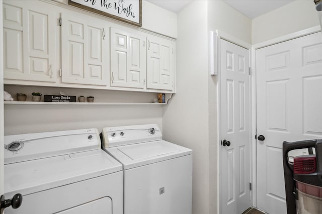 laundry room featuring washer and dryer and cabinet space