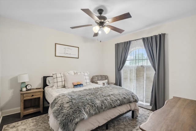 bedroom featuring baseboards and a ceiling fan