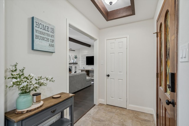 interior space with a fireplace and baseboards
