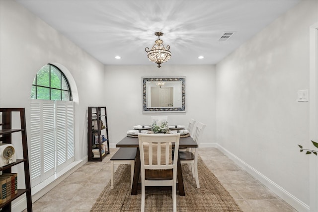 dining area with light tile patterned floors, recessed lighting, visible vents, and a chandelier