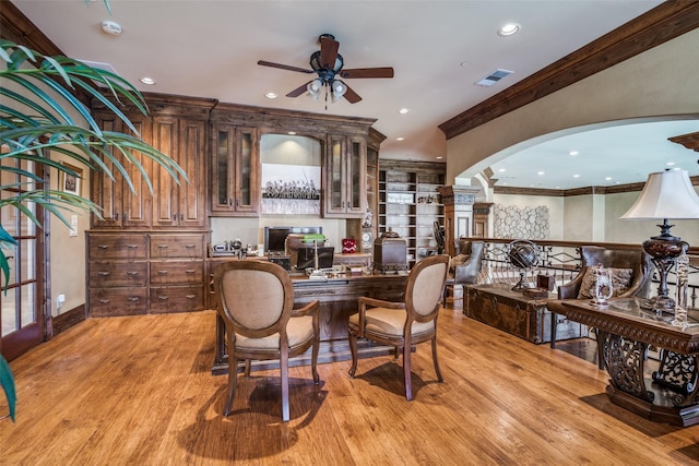 office area featuring crown molding, ceiling fan, arched walkways, recessed lighting, and visible vents