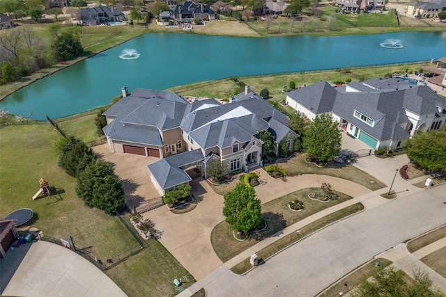 bird's eye view featuring a residential view and a water view