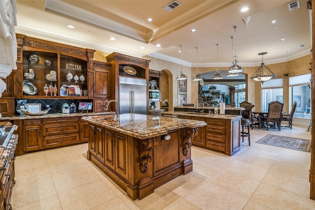 kitchen featuring arched walkways, open shelves, stainless steel appliances, and visible vents