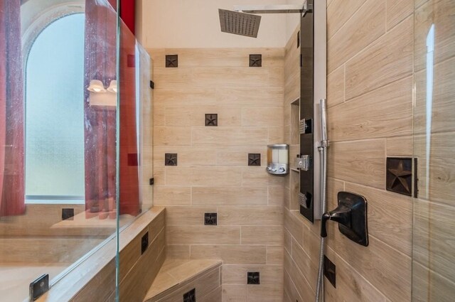 full bathroom with tiled shower