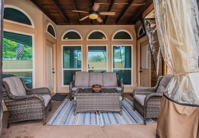 exterior space featuring an outdoor living space and ceiling fan