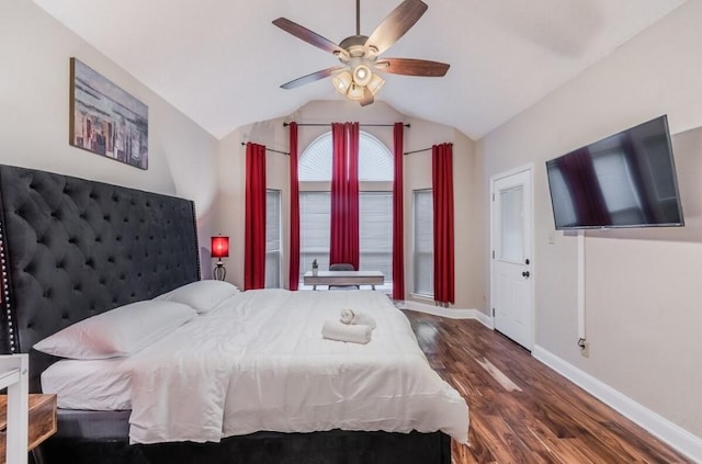 bedroom featuring lofted ceiling, wood finished floors, a ceiling fan, and baseboards