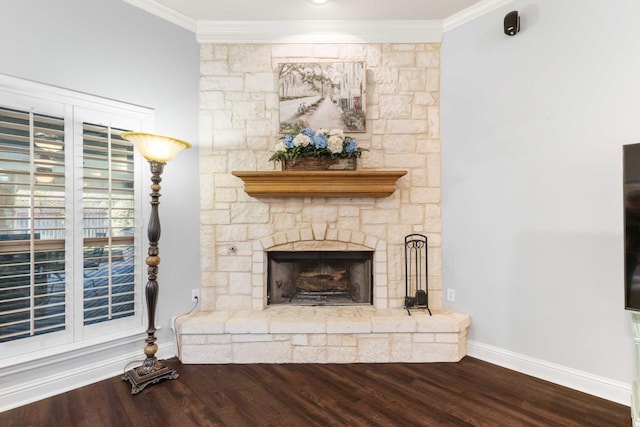 unfurnished living room with a fireplace, wood finished floors, ornamental molding, and baseboards