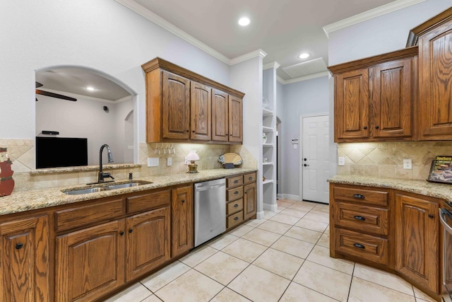 kitchen featuring ornamental molding, stainless steel dishwasher, decorative backsplash, and a sink