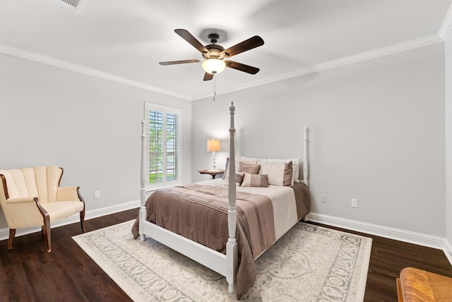 bedroom featuring wood finished floors, crown molding, a ceiling fan, and baseboards