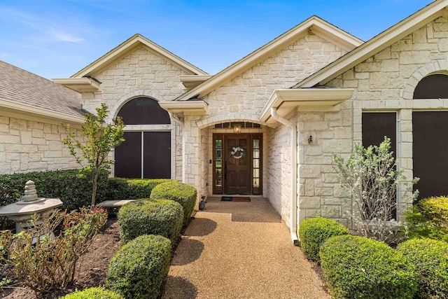 view of exterior entry with stone siding