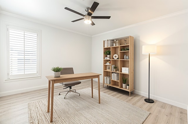 office area featuring ornamental molding, light wood-style flooring, and baseboards