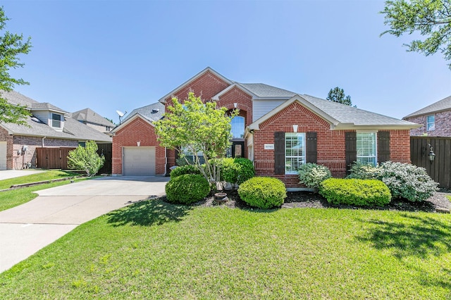 view of front of property featuring fence, a front lawn, and brick siding