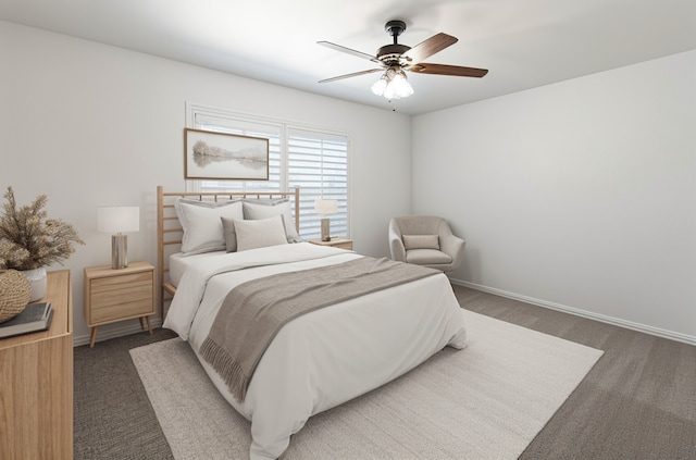 carpeted bedroom with baseboards and ceiling fan