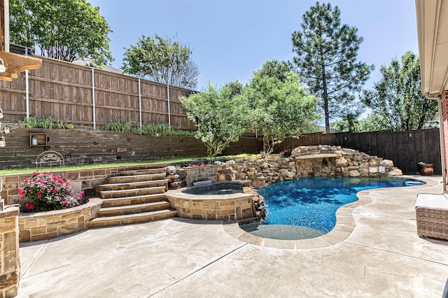 view of swimming pool featuring a patio, a fenced in pool, a fenced backyard, and an in ground hot tub
