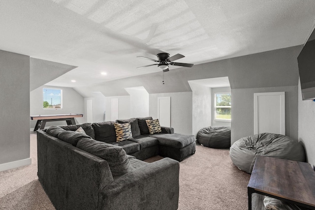 2214 Norwood St, Sherman, TX 75092 - carpeted living area with ceiling fan, a textured ceiling, lofted ceiling, and baseboards