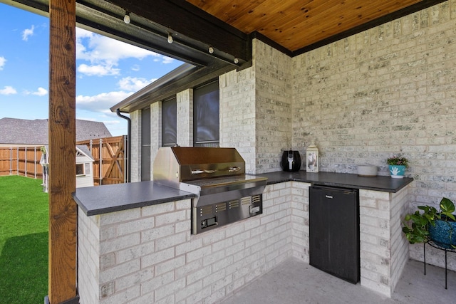 2214 Norwood St, Sherman, TX 75092 - view of patio / terrace featuring fence, area for grilling, and an outdoor kitchen
