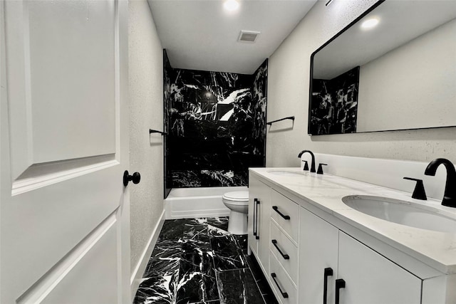 full bathroom featuring toilet, visible vents, a sink, and marble finish floor