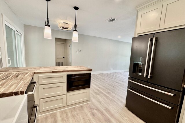318 Live Oak Ln, Weatherford, TX 76086 - unfurnished living room with baseboards, a ceiling fan, light wood-style flooring, and visible vents