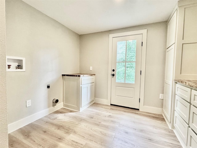 clothes washing area featuring light wood-type flooring, hookup for a washing machine, cabinet space, and hookup for an electric dryer