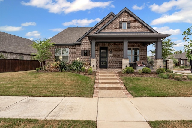 4801 Park View Pl, Arlington, TX 76005 - craftsman house featuring a front yard, fence, and brick siding