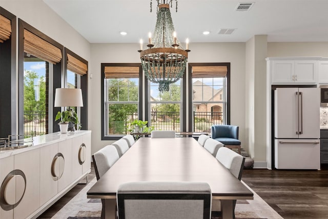 4801 Park View Pl, Arlington, TX 76005 - dining space featuring a chandelier, visible vents, dark wood finished floors, and plenty of natural light