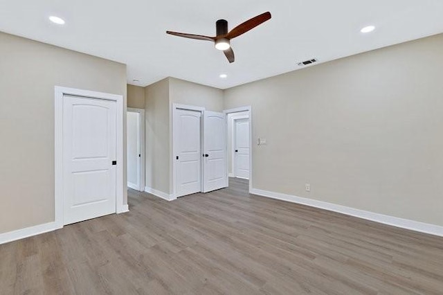 1301 N Sylvania Ave, Fort Worth, TX 76111 - unfurnished bedroom with wood finished floors, visible vents, and baseboards