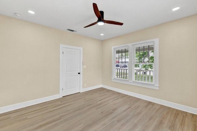 1301 N Sylvania Ave, Fort Worth, TX 76111 - spare room with baseboards, visible vents, wood finished floors, and a ceiling fan