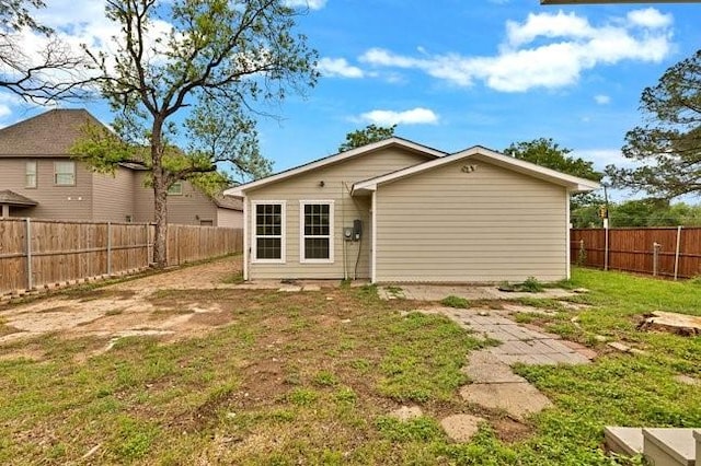 1301 N Sylvania Ave, Fort Worth, TX 76111 - rear view of house with a yard and a fenced backyard