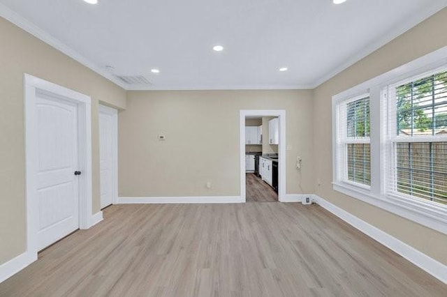 1301 N Sylvania Ave, Fort Worth, TX 76111 - spare room featuring light wood-type flooring, crown molding, recessed lighting, and baseboards
