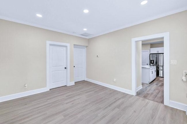 1301 N Sylvania Ave, Fort Worth, TX 76111 - spare room with baseboards, recessed lighting, light wood finished floors, and crown molding
