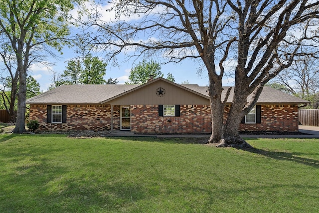 single story home with fence and brick siding