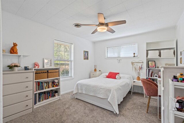 bedroom featuring a ceiling fan and carpet