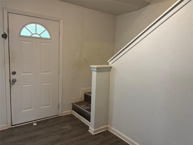 entryway with baseboards, dark wood finished floors, and stairs