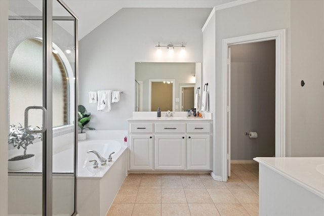 bathroom featuring a garden tub, a stall shower, and vanity