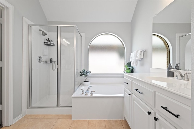 full bath featuring a garden tub, vanity, tile patterned flooring, and a stall shower