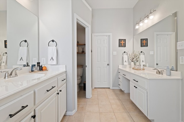 bathroom with two vanities, a sink, and tile patterned floors