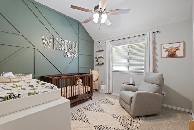 bedroom with baseboards, a ceiling fan, light carpet, and lofted ceiling
