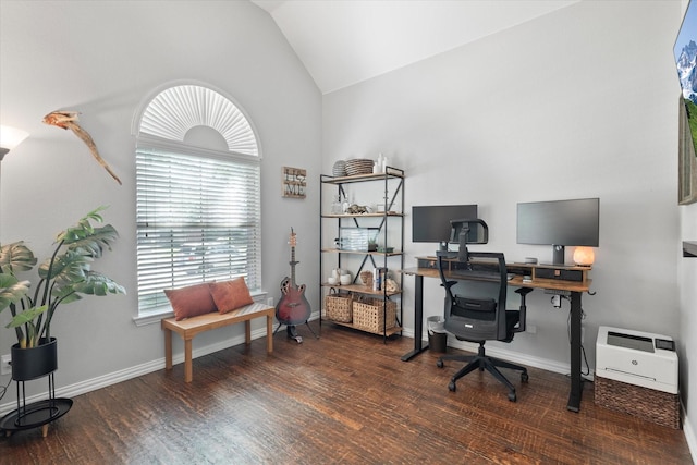 office space with baseboards, wood finished floors, and lofted ceiling