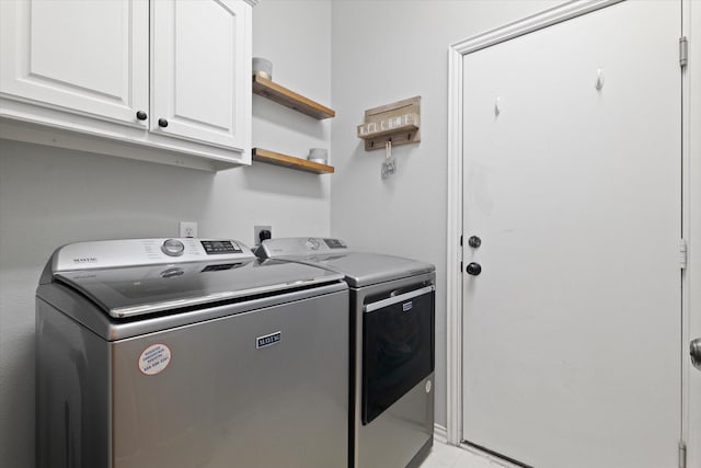 laundry room featuring washer and dryer and cabinet space