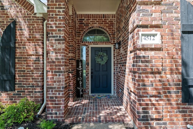 entrance to property with brick siding