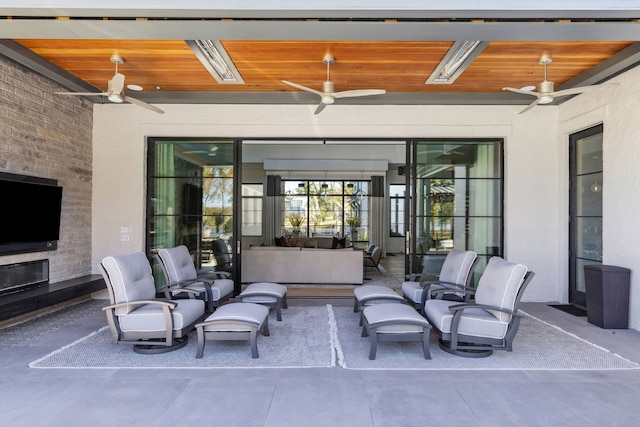 view of patio / terrace featuring ceiling fan and outdoor lounge area