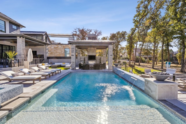 outdoor pool featuring an outdoor living space with a fireplace and a patio area