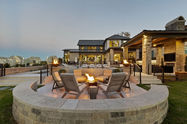 view of patio / terrace featuring an outdoor living space with a fireplace