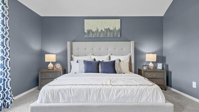 bedroom with baseboards and carpet floors