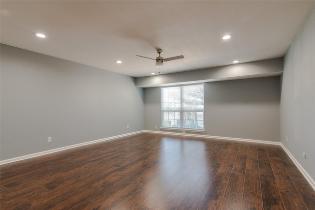 empty room featuring baseboards, recessed lighting, ceiling fan, and dark wood-style flooring